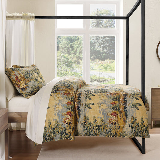Bed with floral bedding in a bright bedroom with large windows.
