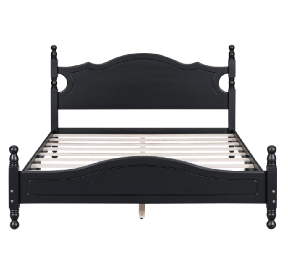 Black wooden bed frame on a white background