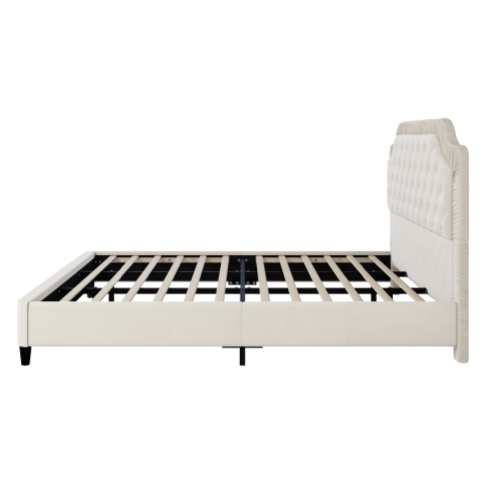 White bed frame with tufted headboard on a white background