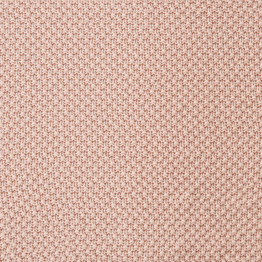 Close-up of a textured pink fabric surface