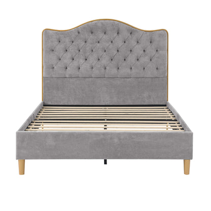 Gray tufted bed with wooden slats on a white background
