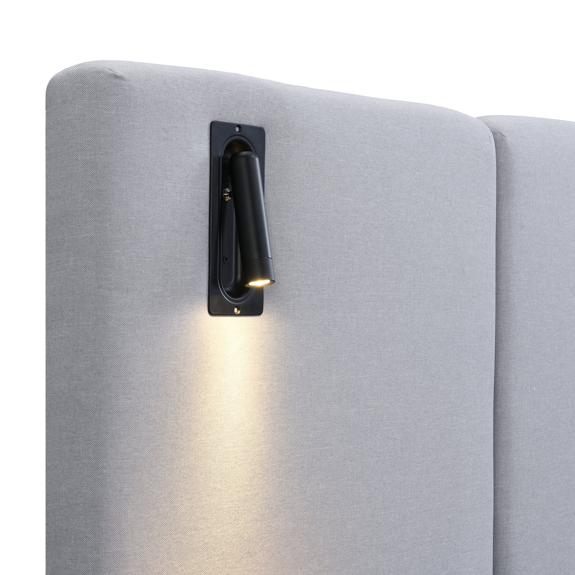 Black wall-mounted light fixture on a gray wall