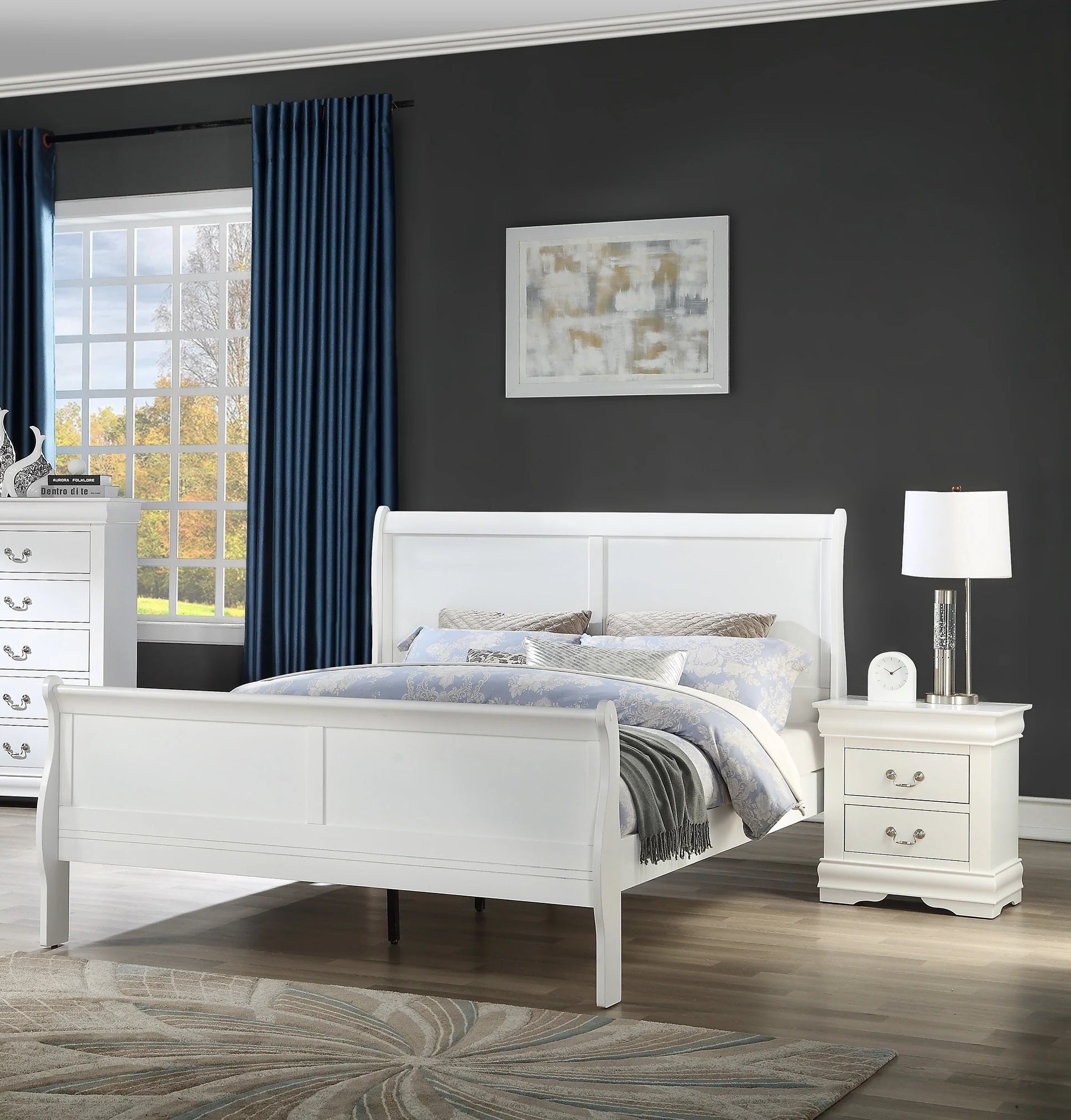 Neatly arranged bedroom with a white bed, nightstand, and dresser against a dark wall.