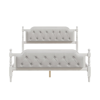 Gray upholstered bed with tufted design on a white background