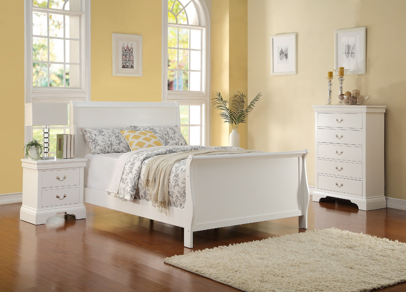 White bedroom furniture set with bed, nightstands, and dresser against a yellow wall.