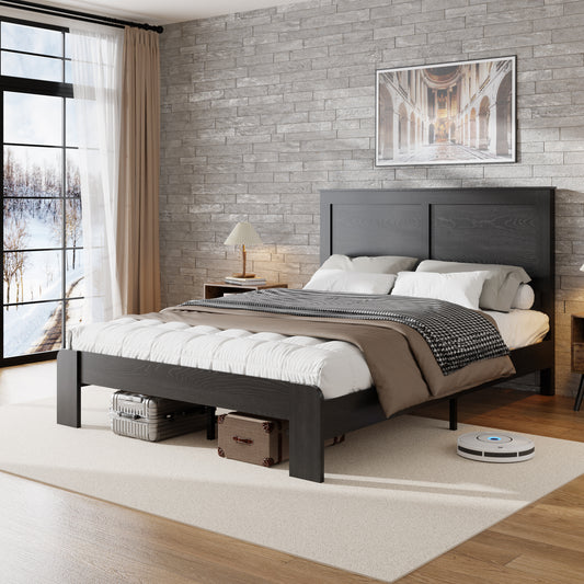 Modern bedroom with a black bed frame, white bedding, and decorative elements.