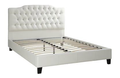 White tufted bed frame on a white background