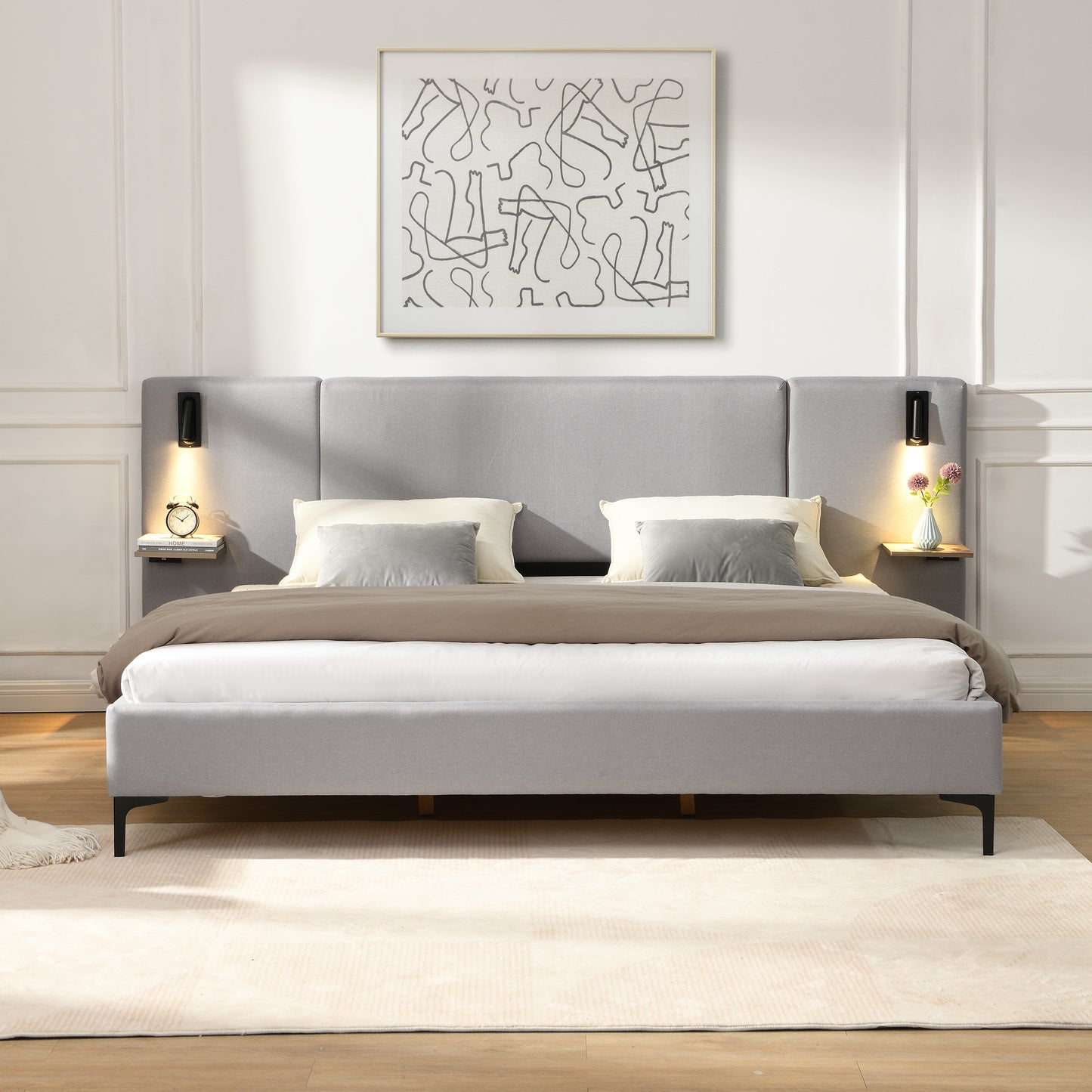Gray upholstered bed with white bedding in a modern bedroom setting.