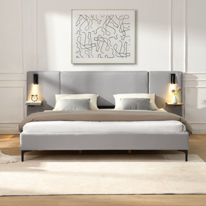 Gray upholstered bed with white bedding in a modern bedroom setting.