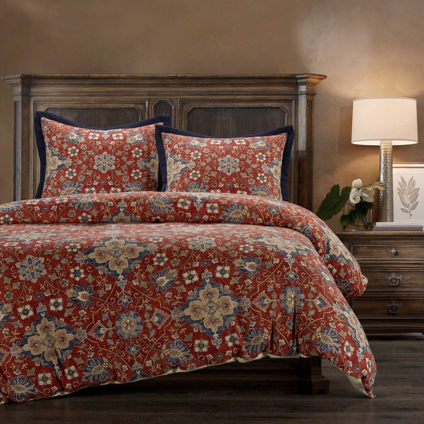 Floral patterned bedding set on a bed in a bedroom setting.
