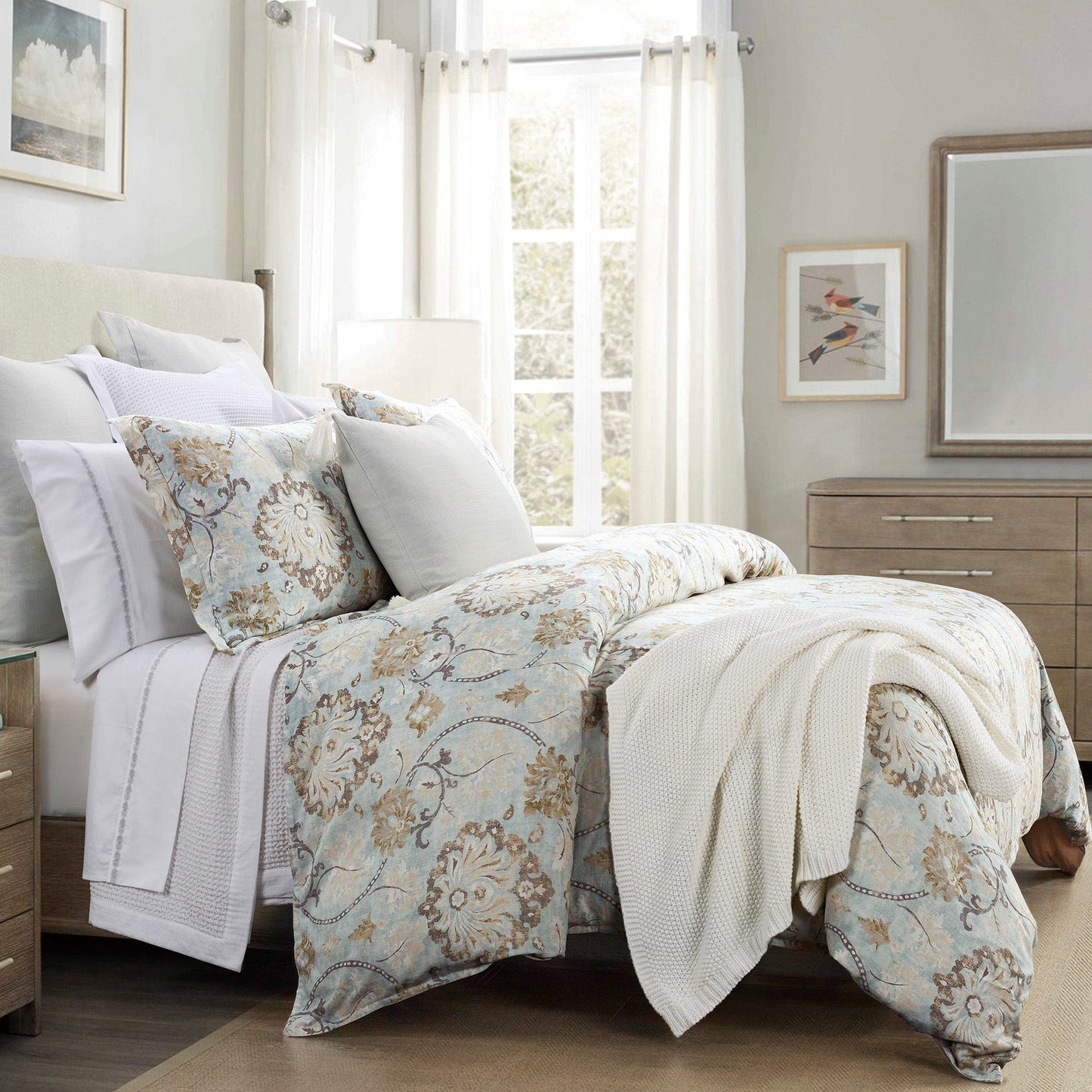 Bedroom with floral bedding and neutral decor