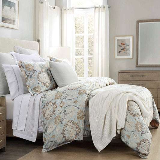 Bedroom with floral bedding and neutral decor