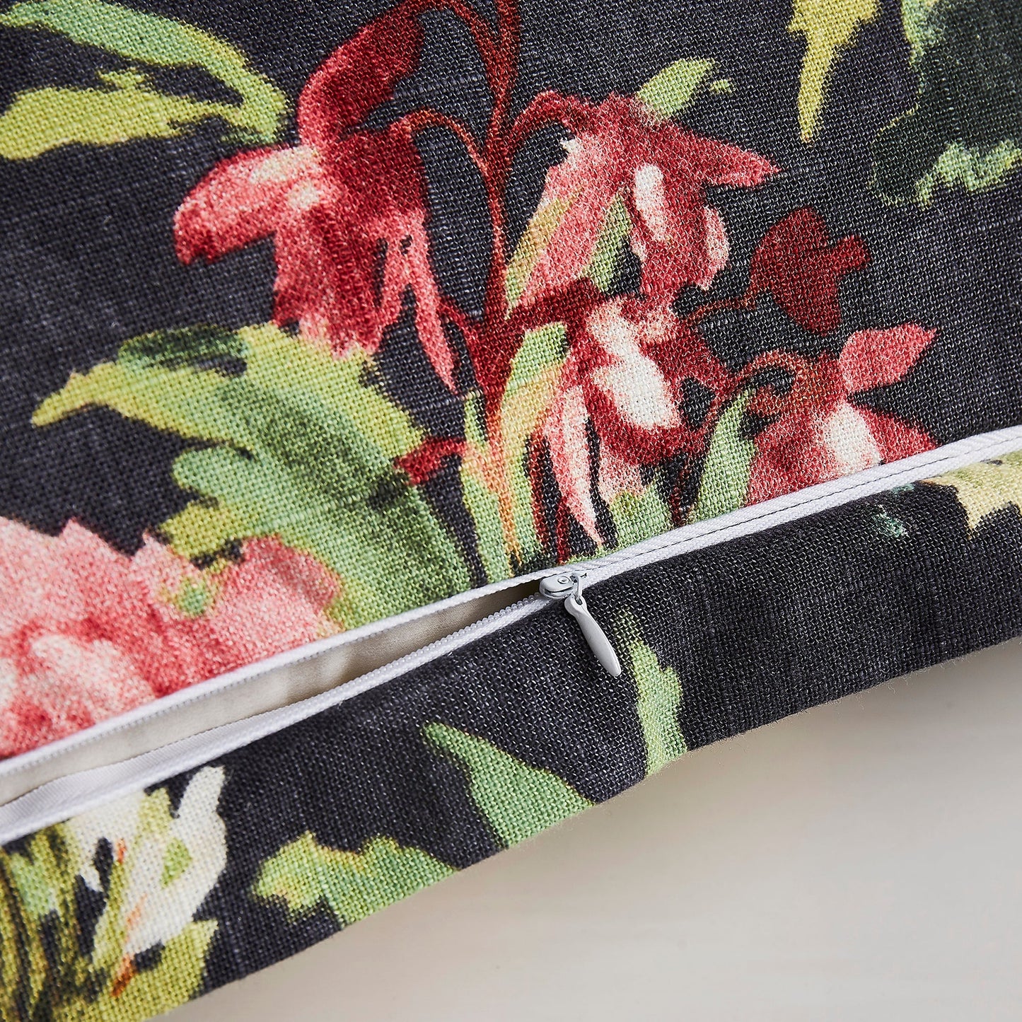 Floral patterned pouch with a zipper on a neutral background