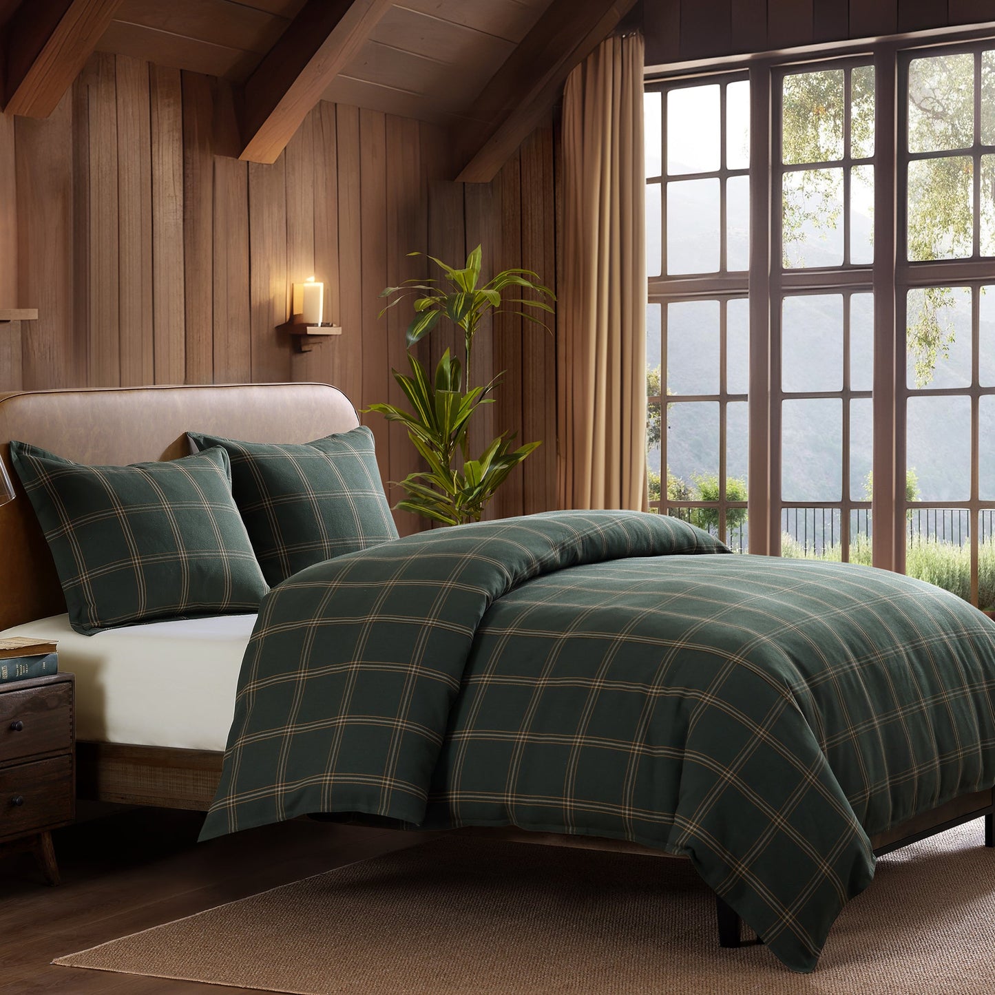 Bedroom with plaid green bedding and large windows