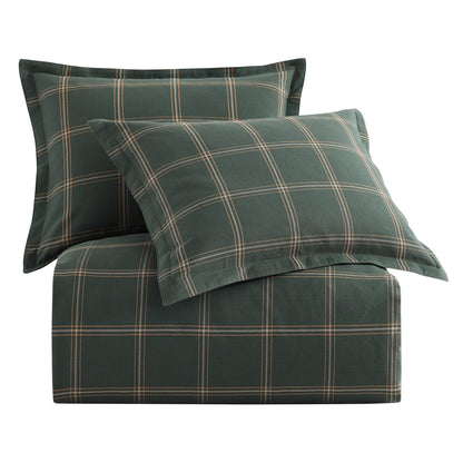 Green plaid bedding set with two pillows on a white background