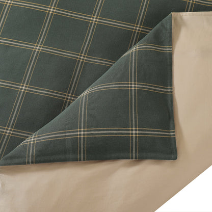 Plaid fabric with green and beige colors on a white background