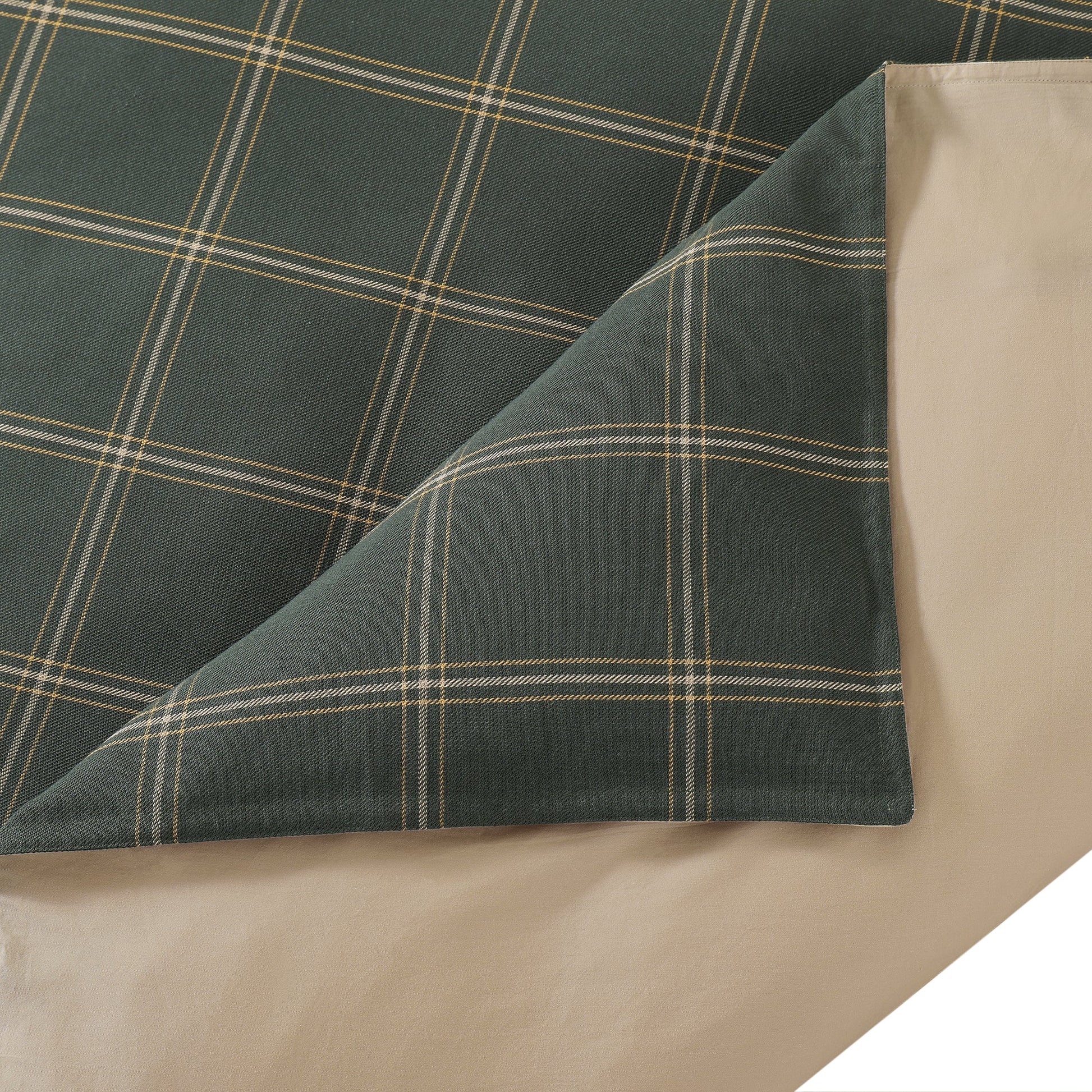 Plaid fabric with green and beige colors on a white background
