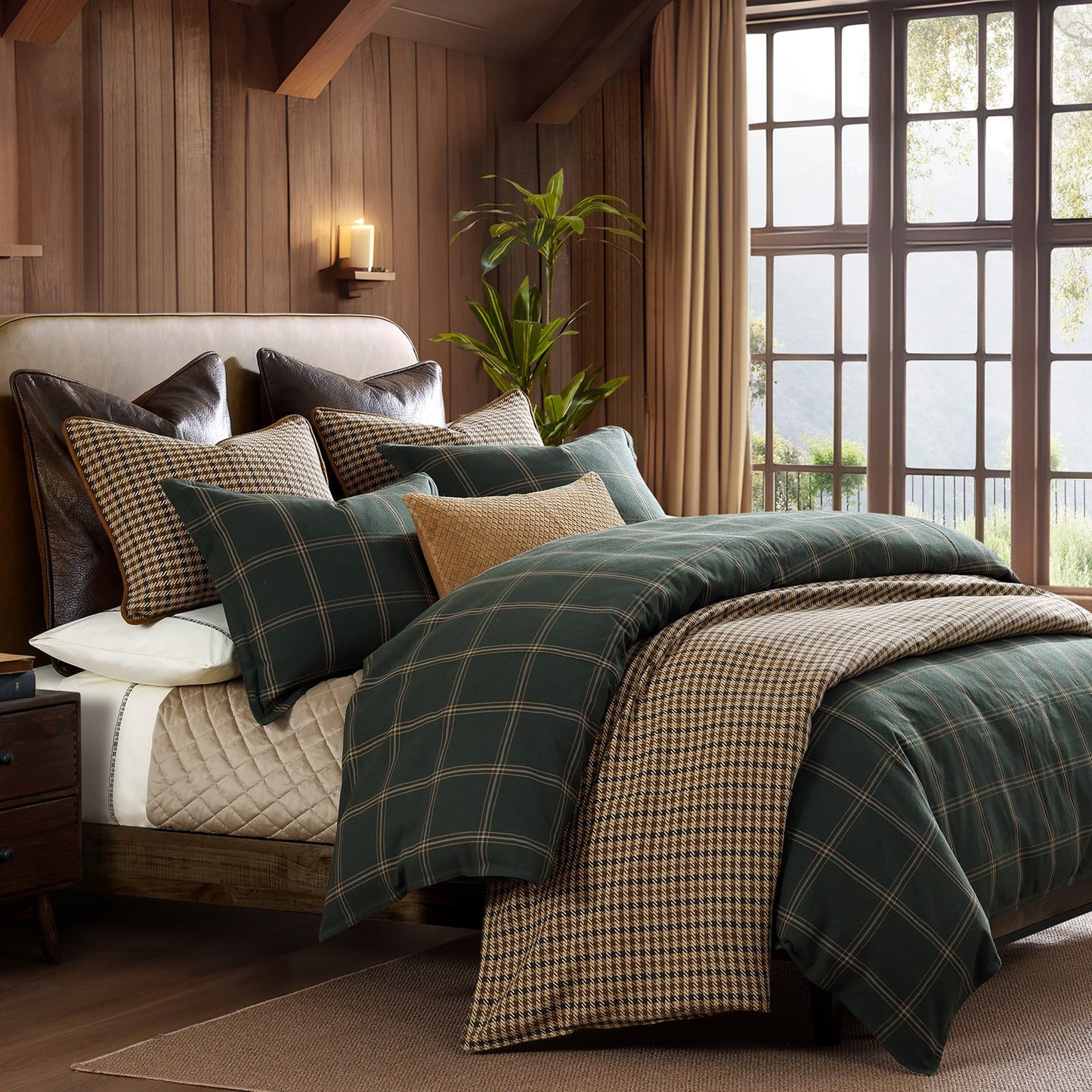 Bedroom with plaid bedding and pillows in a cozy room setting.