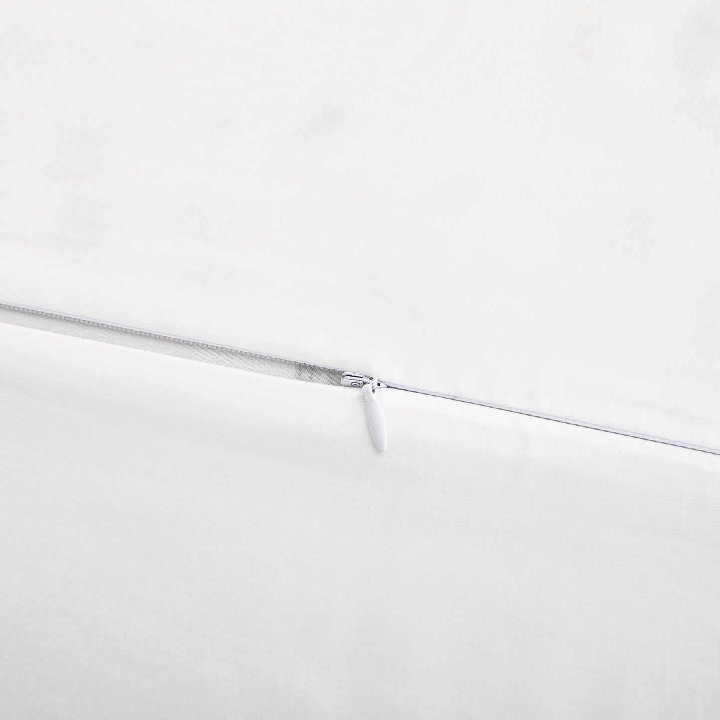 Close-up of a zipper on a white background
