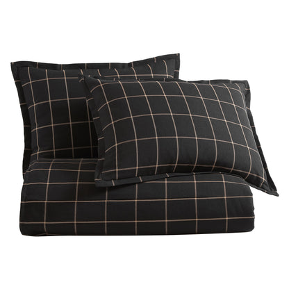 Black checkered pillowcase and duvet cover set on a white background