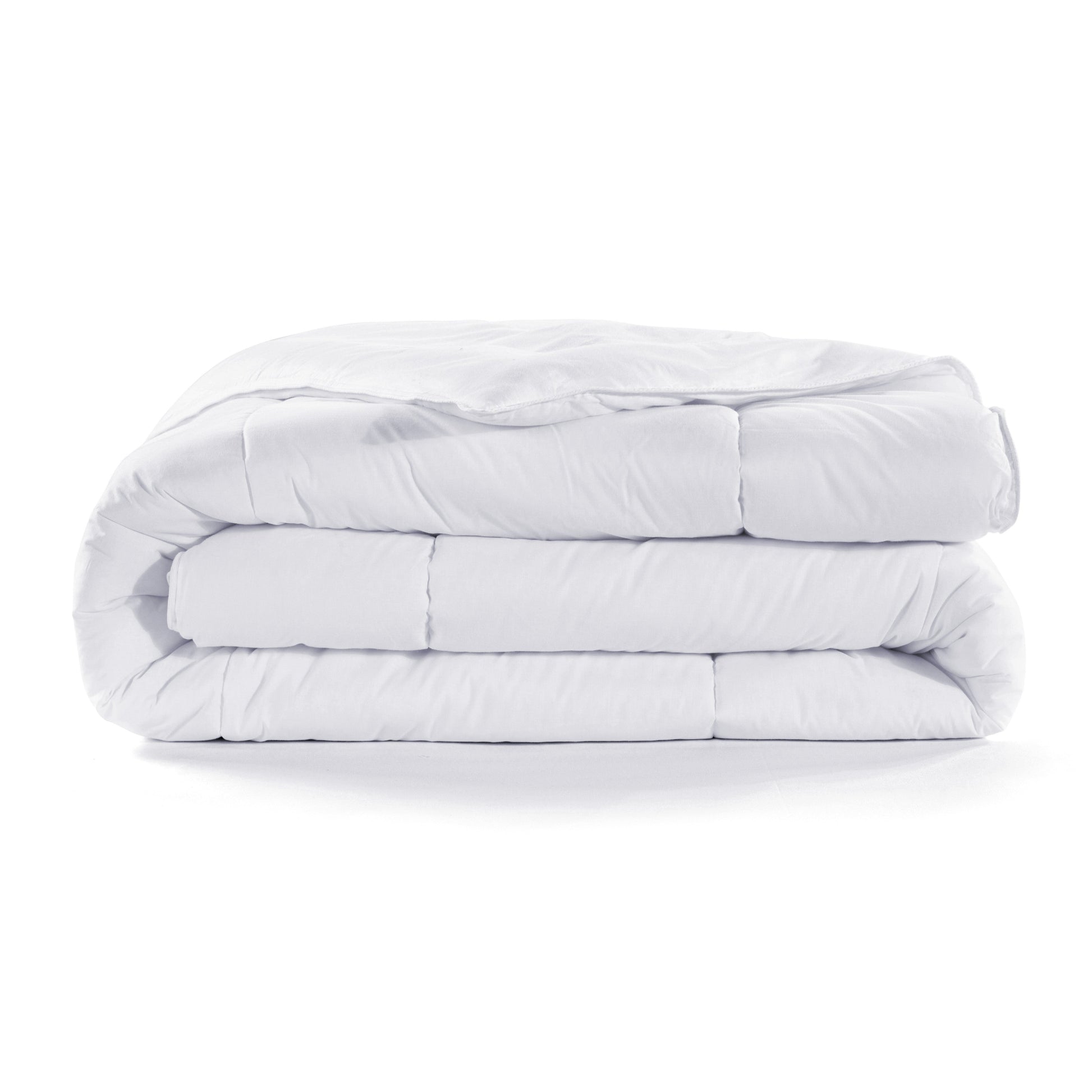 Stack of white comforters on a white background
