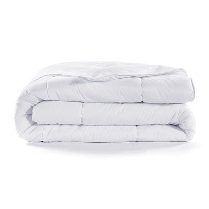 Stack of white comforters on a white background