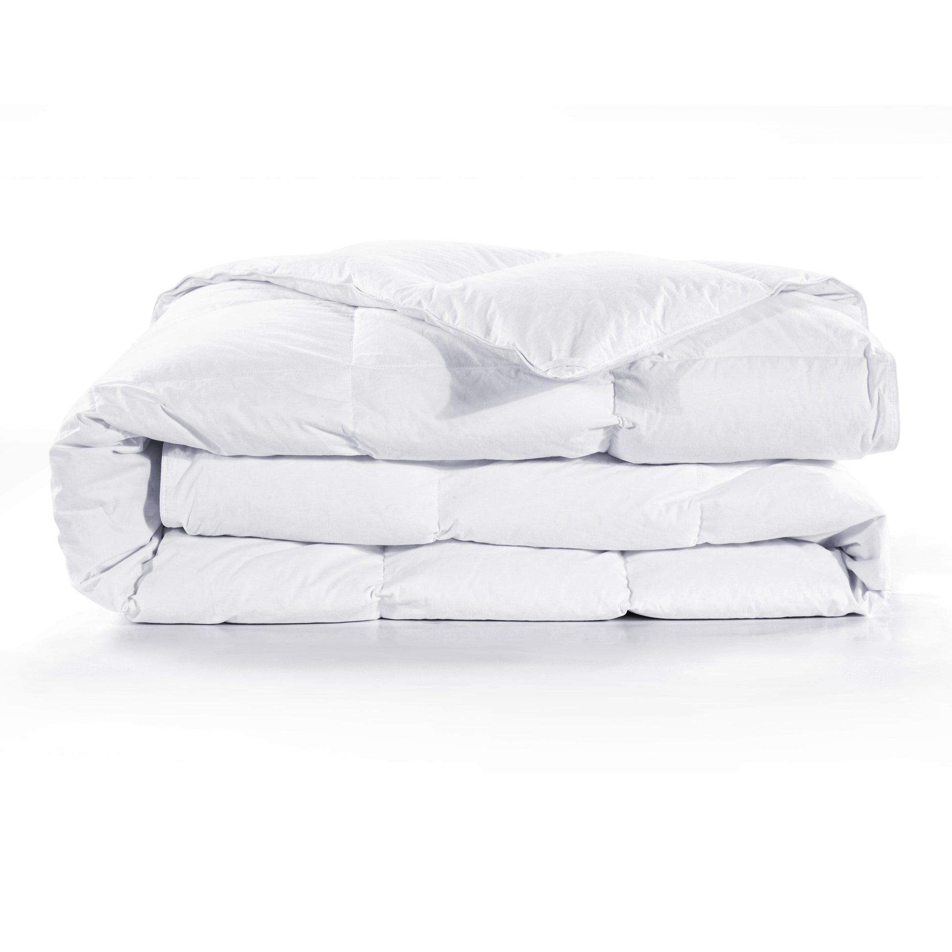 Folded white comforter on a white background
