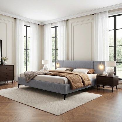 Modern bedroom with a gray upholstered bed, wooden nightstands, and large windows.