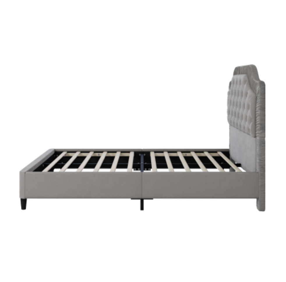 Gray upholstered bed frame on a white background Side View