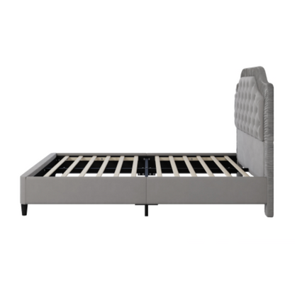 Gray upholstered bed frame on a white background Side View
