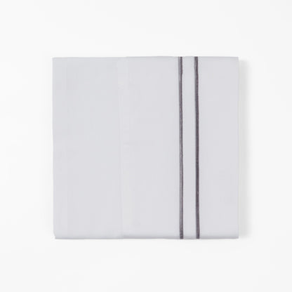 White pillowcase with a thin gray stripe on a white background