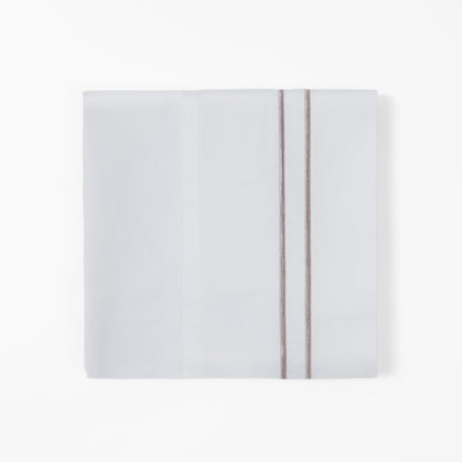 White notebook with a red ribbon on a white background