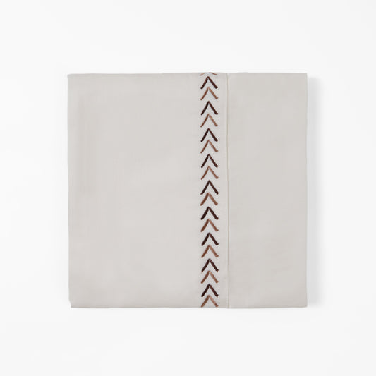 Rectangular pouch with a pattern of vertical chevron lines on a beige background