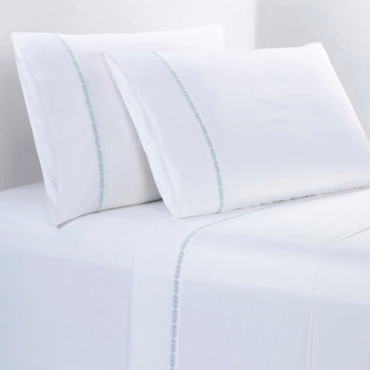 White bed sheets with subtle blue stripes on a white background