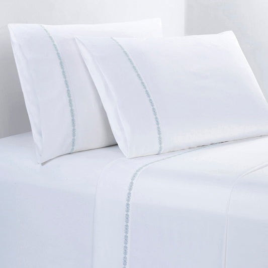 White bed sheets with subtle blue stripes on a white background
