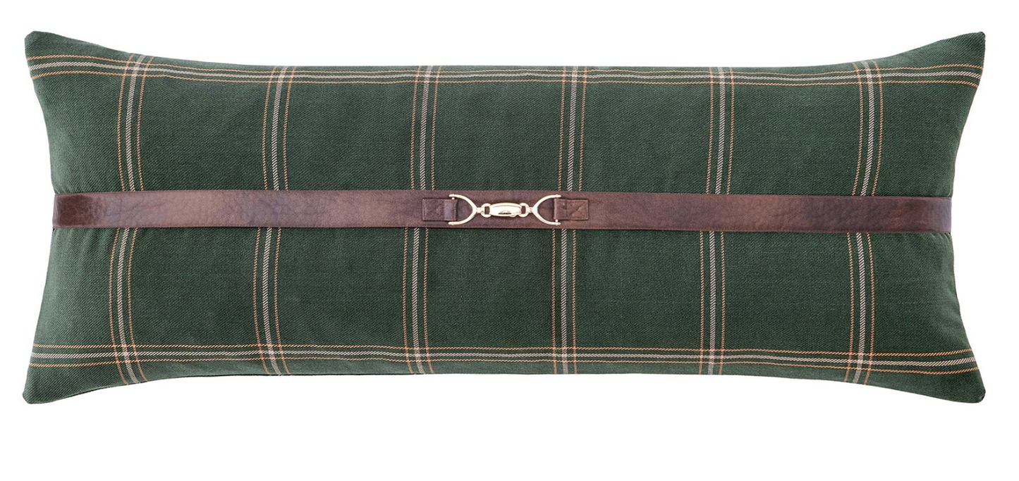 Green plaid pillow with a brown leather strap on a white background