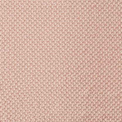 Close-up of a textured pink fabric surface