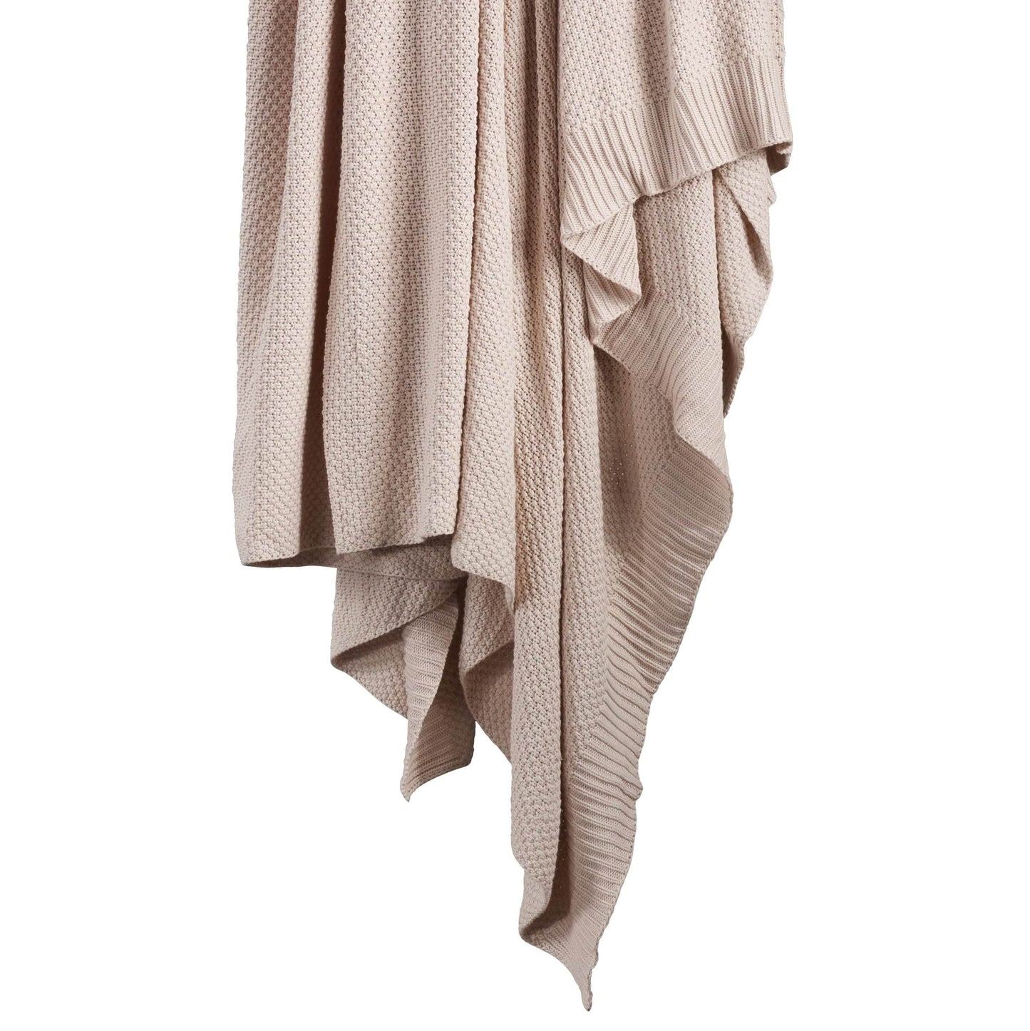 Beige knitted blanket draped over a white background