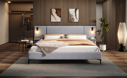 Modern bedroom with a gray bed, wooden floor, and wall art.