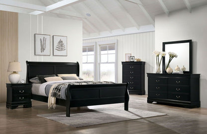 Black bedroom furniture set with bed, dresser, and mirror in a room with large windows.