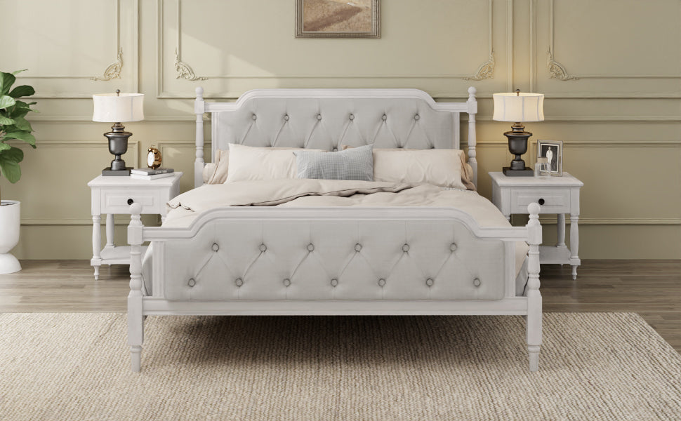 Gray upholstered bed in a bedroom setting with matching nightstands and lamps.